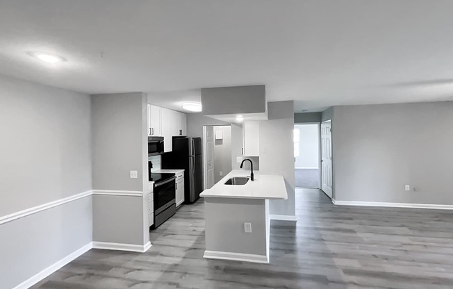 Plenty of room for entertaining in this epic kitchen/dining/living area at Cypress Grand Apartments