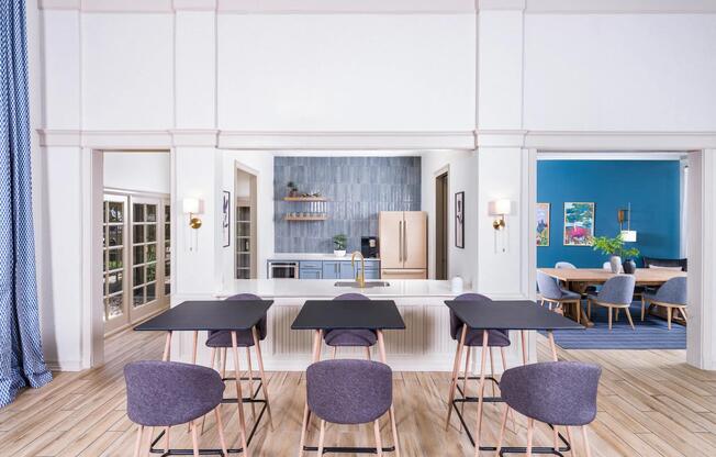A stylish community kitchen with open shelving and vibrant finishes—perfect for casual gatherings or hosting friends.