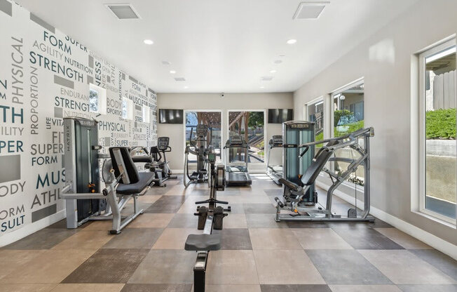 Community Fitness Center with Equipment & Window View at Forest Park Apartments in El Cajon, CA.