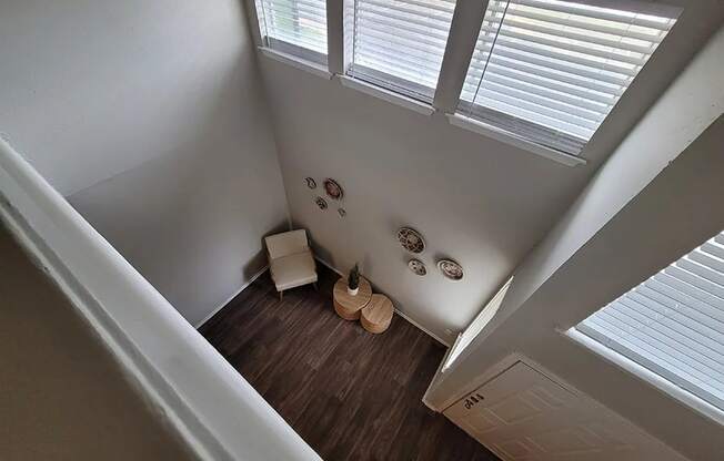 an overhead view of a room with a chair and a vase at Ivy Plains at Brooks Apartments, San Antonio , Texas