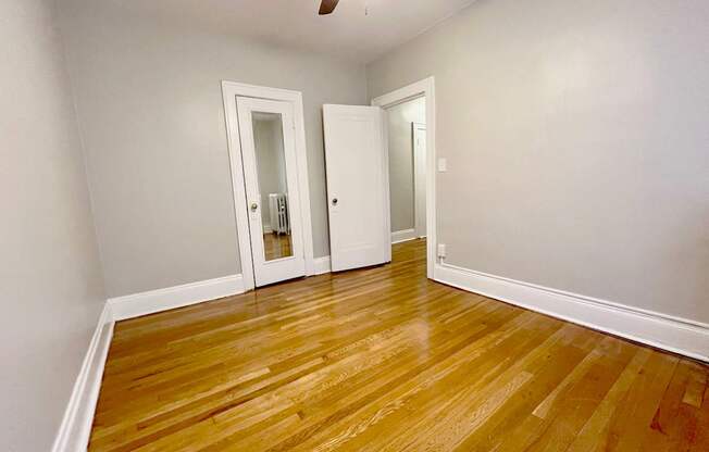 Mapleview bedroom with closet and ceiling fan.