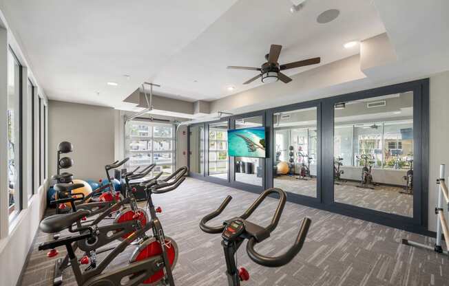 the gym at the district flats apartments in lenexa