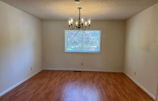 Lots of Square Footage in this wonderful 4 Bedroom (+ Bonus Room) 2.5 Bath Home...Beautiful Park Like Backyard.