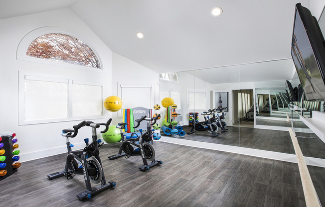 Fitness studio with bikes and free weights