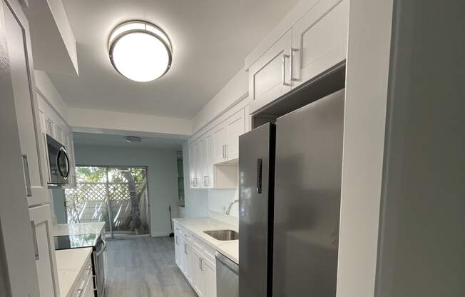 Kitchen with White Cabinets and Stainless Steel Appliances