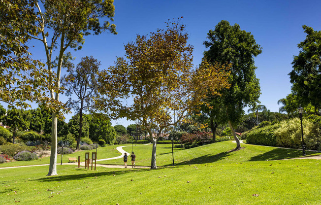 a park with trees and a path in the grass at La Jolla Blue, San Diego