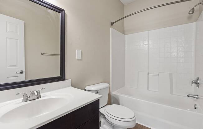 the preserve at ballantyne commons apartment bathroom with sink toilet and shower