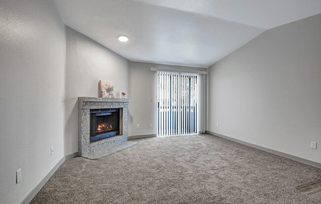 a living room with a fireplace and a window