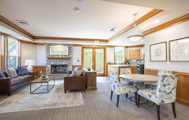 Resident clubhouse lounge area with fireplace - Springbrook Apartments