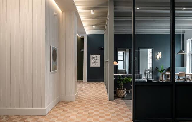 a view of a hallway with a lobby and a reception desk