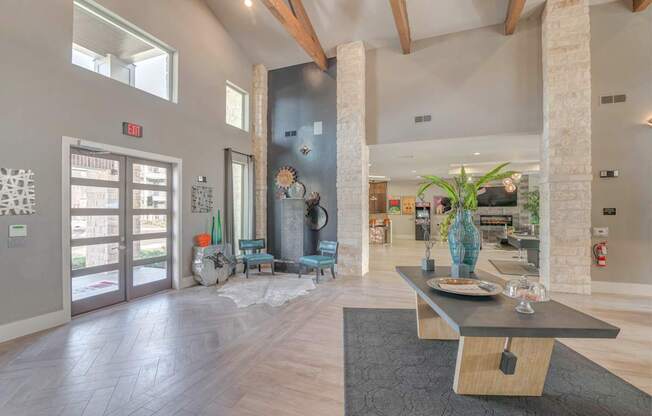 A modern living room with a wooden floor and a large window.