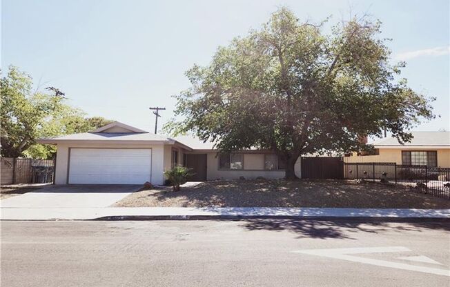 Spacious 4-Bed Home with Pool & Fireplace in 89102!