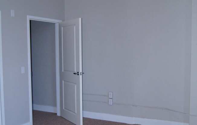 an empty room with a door open to a closet at Residences at South High, Pittsburgh, 15203 ? 