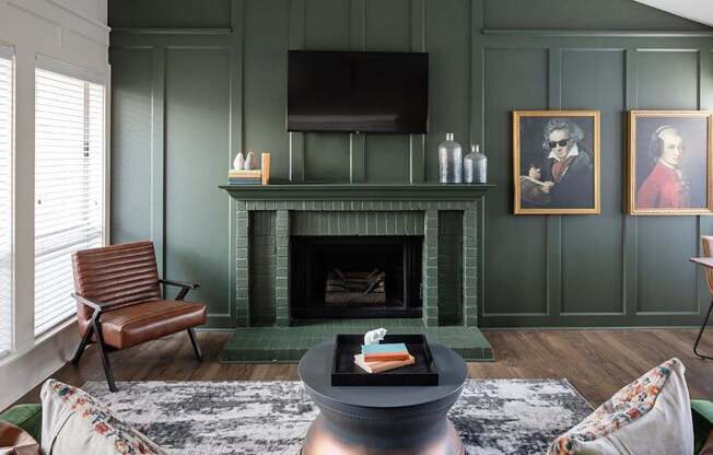 A living room with a fireplace and a chair.