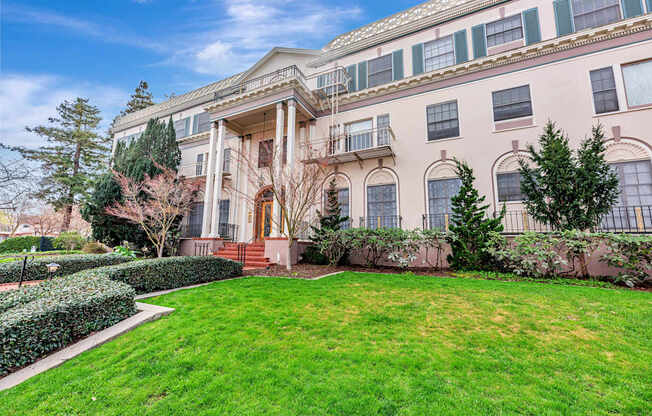 A large, two-story building with a balcony on the second floor.
