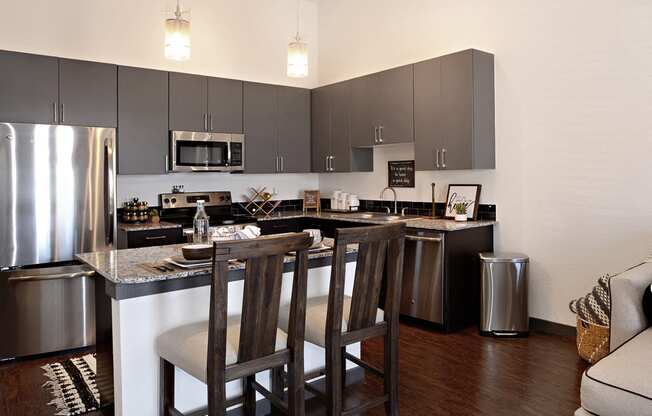stainless steel. Every kitchen has a large island! at Epic Apartments, Denton, Texas