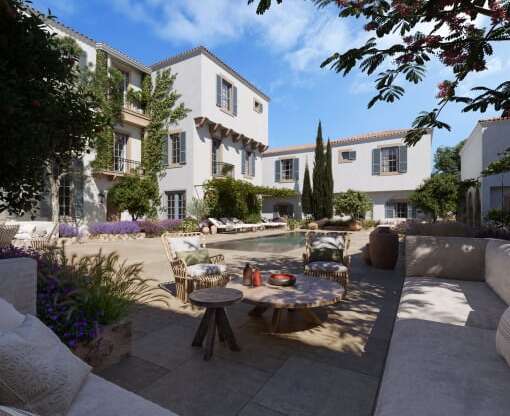 a patio with a table and chairs and a swimming pool