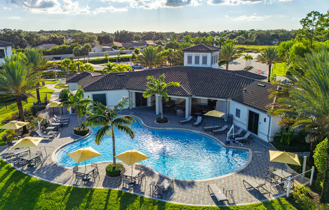 A large house with a pool in the backyard.