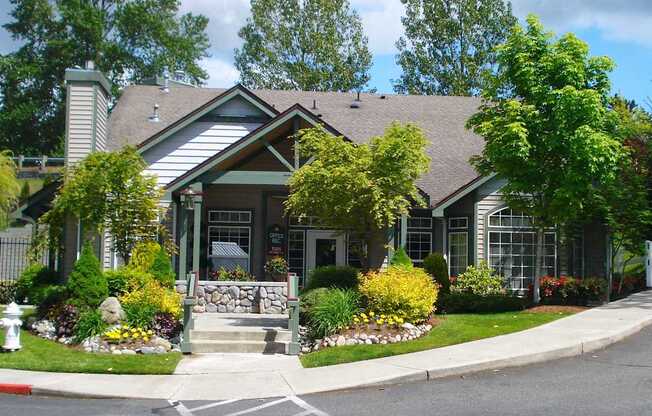 A house with a front yard and a fire hydrant.