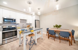 Apartment kitchen with island and dining table