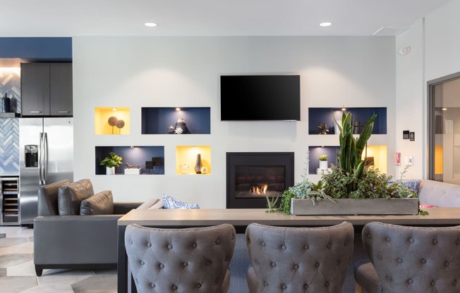 a living room with a fireplace and a tv on the wall