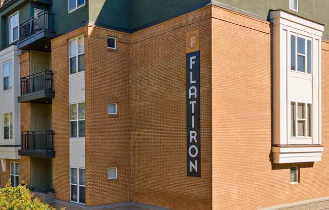 Flatiron West Trade Apartments exterior view of building with "Flatiron" on the side