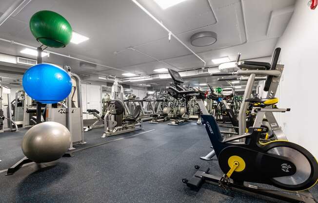 a gym with weights and other exercise equipment in a building