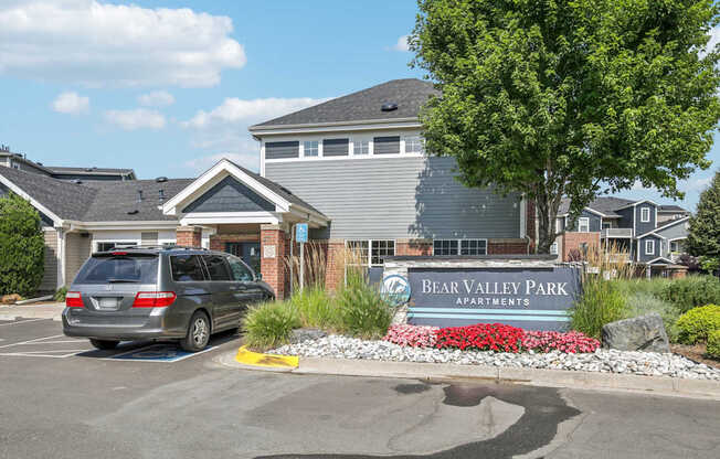 A Bear Valley Park sign is in front of a building.