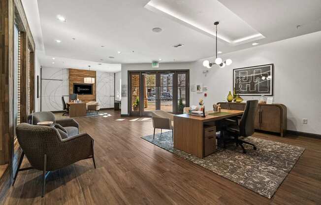 A modern office with wood floors and furniture.