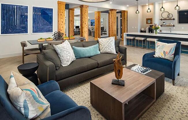 a living room with a couch and a coffee table at Promenade at Newnan Crossing, Newnan