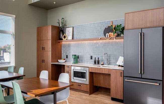 a kitchen and dining area with a table and chairs