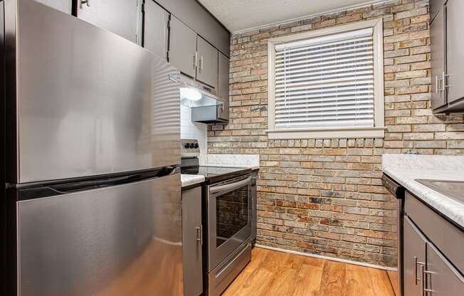 Upgraded kitchen with brick exposures at Retreat at St. Andrews, Columbia