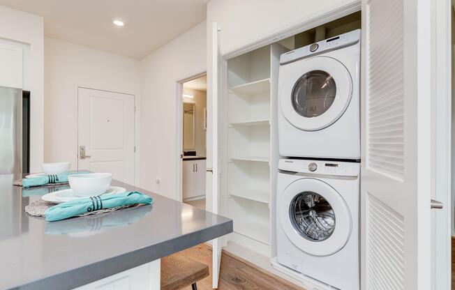 a kitchen with a sink and a mirror