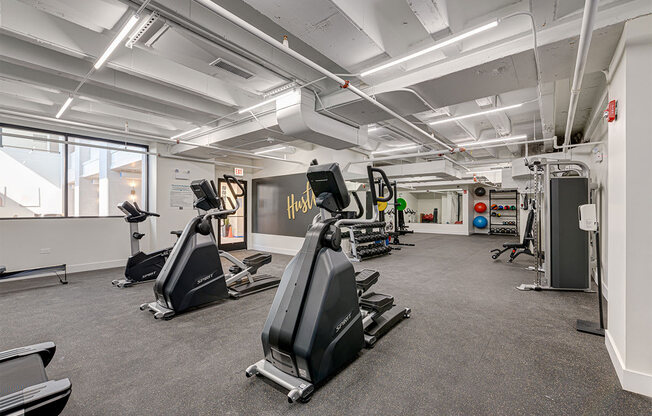 a gym with treadmills and other exercise equipment in a building