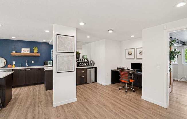 Business Center and Coffee Bar with a desk and a chair in it.