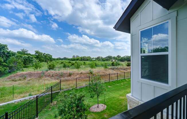 the view of the yard from the balcony of a home at Legacy at Cibolo, Boerne, TX, 78006