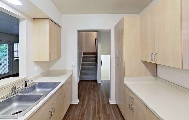 A kitchen with a microwave, stove and a sink at Foxwood and The Hermitage, Portage, MI, 49024