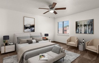 a bedroom with a large bed and a ceiling fan