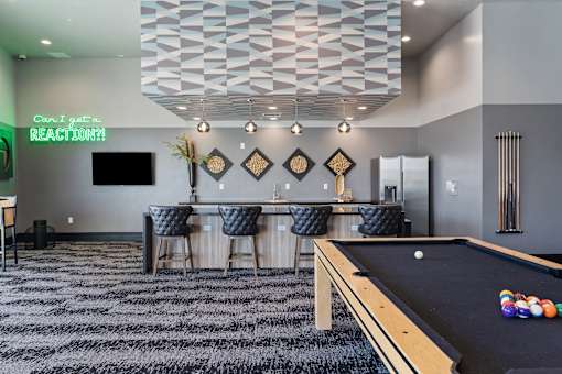 a game room with a pool table and a bar at SevenO2 Main Apartments, Salt Lake City, UT, 84101