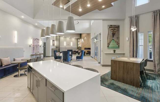 A modern kitchen with a white countertop and a blue bench.