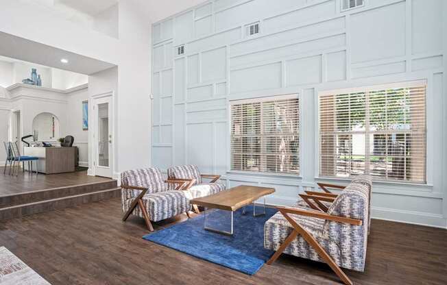 Clubhouse area in leasing office with seating and a coffee table.