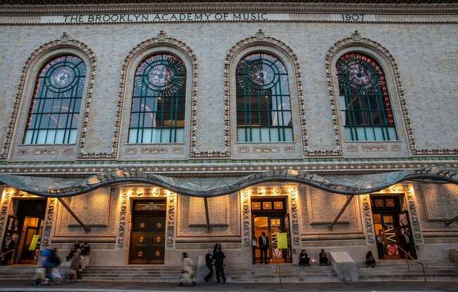 people walking in front of the building at The Paxton, Brooklyn