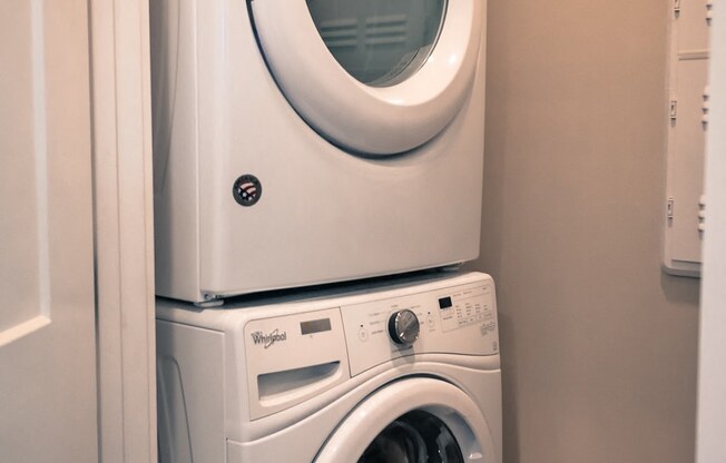 a small laundry room with a washer and dryer