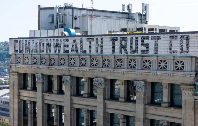 a sign on the top of a building that reads commonwealth trust co at The Commonwealth Building, Pittsburgh, 15222