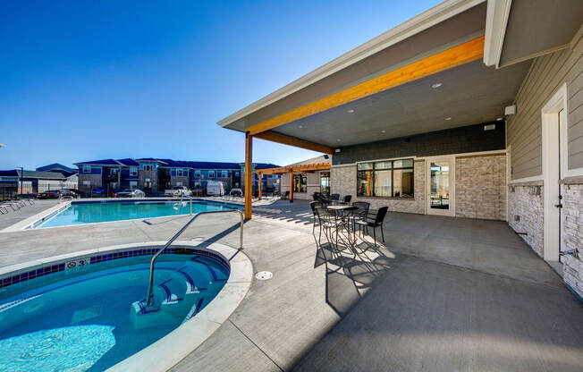 Outdoor hot tub next to swimming pool