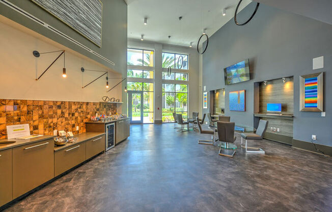 a large lobby with a reception desk and chairs and a large window with a view of the  at Fusion, Florida, 32256