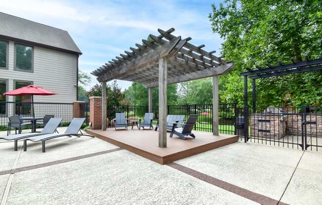 the reserve at bucklin hill leasing office patio with pergola and lounge chairs