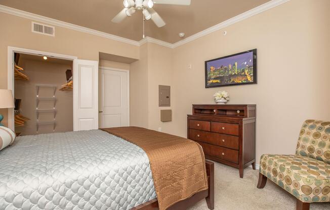 a bedroom with a large bed in a hotel room