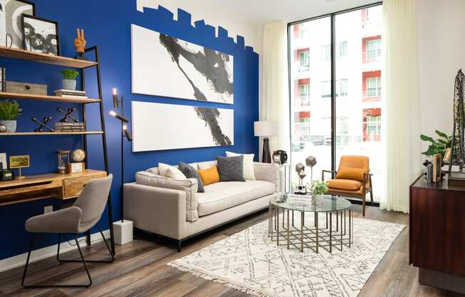 a living room with a blue accent wall