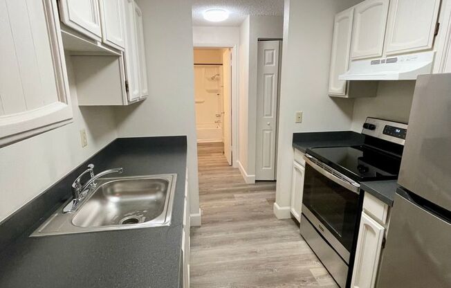 Nicely Renovated 2 Bedroom, 1 Bath Duplex with Washer/Dryer Hookups + Off Street Parking